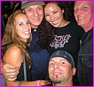 Carin and Dyna from Thund-HER-Struck with a seated friend and Brian Johnson and Chris Slade